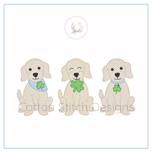 Machine Embroidery design Cotton Stitch Designs Three embroidered dogs with shamrock leaves on a white background, featuring the Cotton Stitch Designs logo.