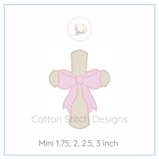 Machine Embroidery design Cotton Stitch Designs Embroidery design of a cross with a pink bow on a white background, labeled 'Cotton Stitch Designs'.