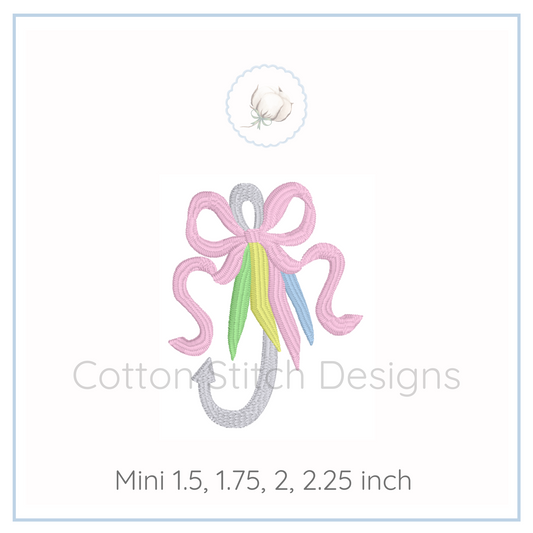 Machine Embroidery design Cotton Stitch Designs Embroidery design of a fish hook with a pink bow with colorful ribbons on a white background, branded 'Cotton Stitch Designs'.