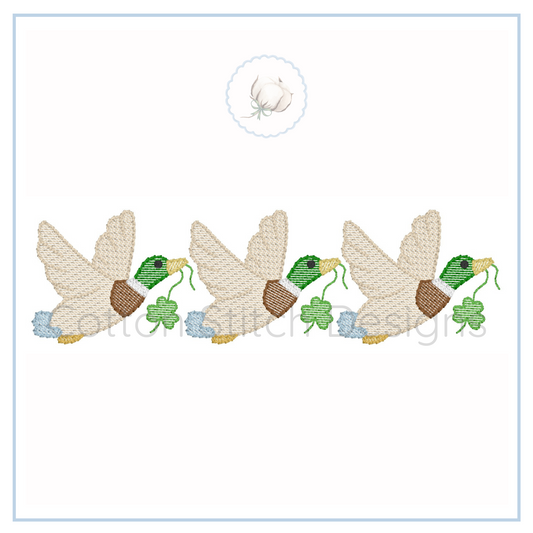 Machine Embroidery design Cotton Stitch Designs Embroidered design of three ducks with clover leaves on a white background