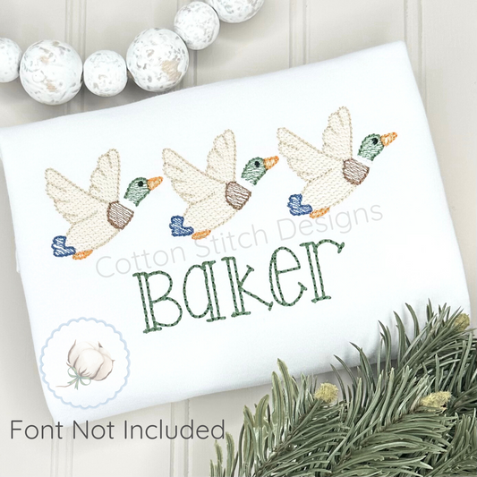 Machine Embroidery design Cotton Stitch Designs Embroidered towel with ducks and the word 'Baker' on a white background.