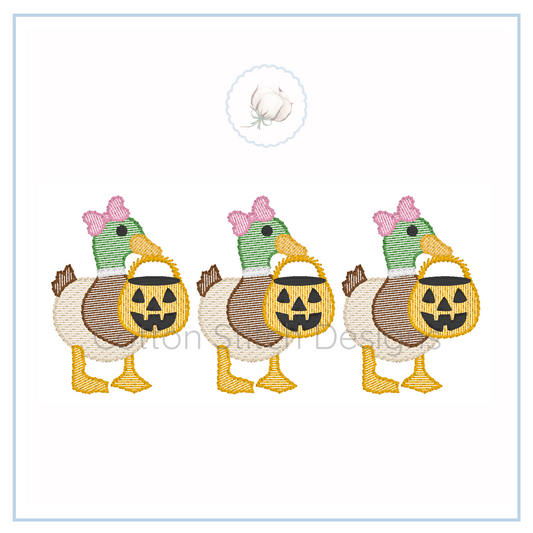 Machine Embroidery design Cotton Stitch Designs Three embroidered ducks with pumpkin faces and baskets on a white background
