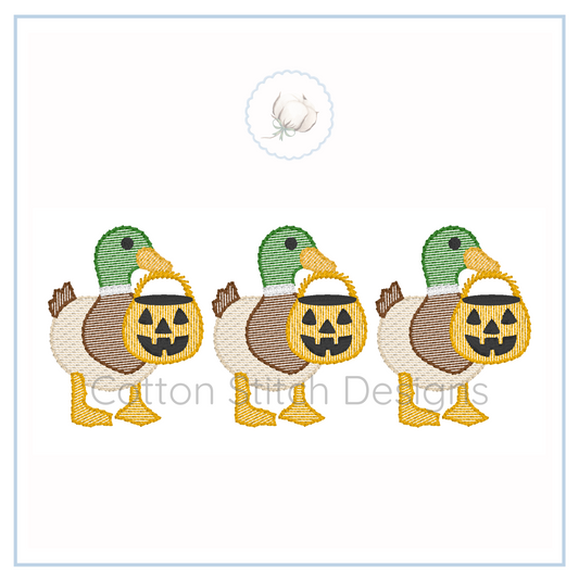 Machine Embroidery design Cotton Stitch Designs Three embroidered ducks with pumpkin baskets on a white card with 'Cotton Stitch Designs' branding.