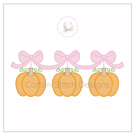 Machine Embroidery design Cotton Stitch Designs Embroidery design of three pumpkins with pink bows on a white background