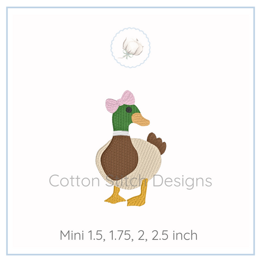 Machine Embroidery design Cotton Stitch Designs Embroidery design of a duck with a pink bow on a white background, featuring the brand 'Cotton Duck Designs'.