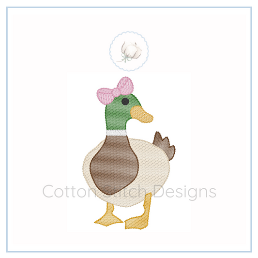 Machine Embroidery design Cotton Stitch Designs Embroidered duck design with a pink bow on a white background, featuring the brand 'Cotton Stitch Designs'.