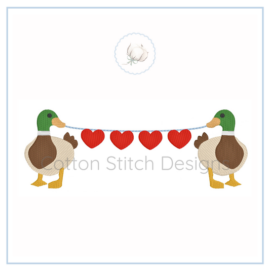 Machine Embroidery design Cotton Stitch Designs Two ducks holding a string with red hearts and 'Cotton Stitch Design' text.
