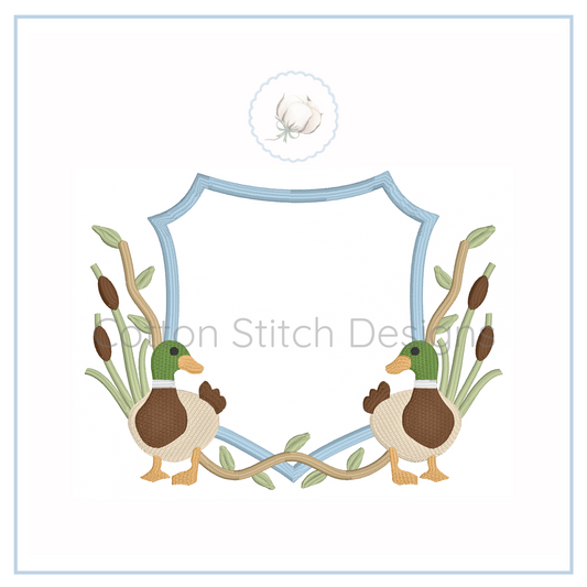 Machine Embroidery design Cotton Stitch Designs Two ducks with reeds crest and a blue frame on a white background