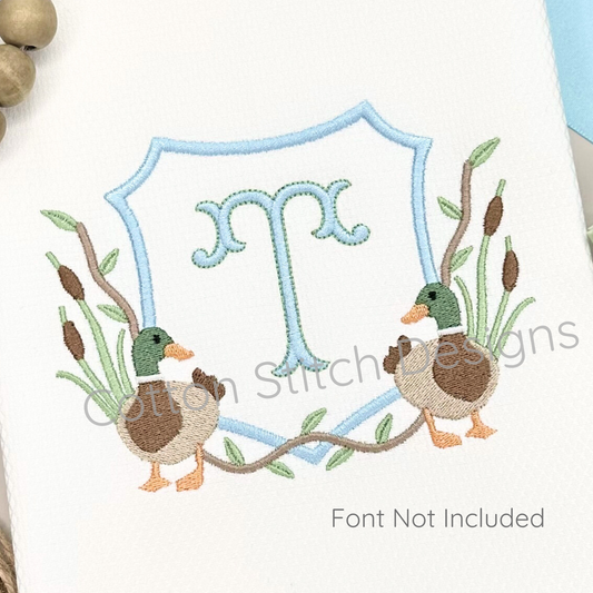 Machine Embroidery design Cotton Stitch Designs Embroidered design with two ducks and a decorative letter 'T' on a white background.