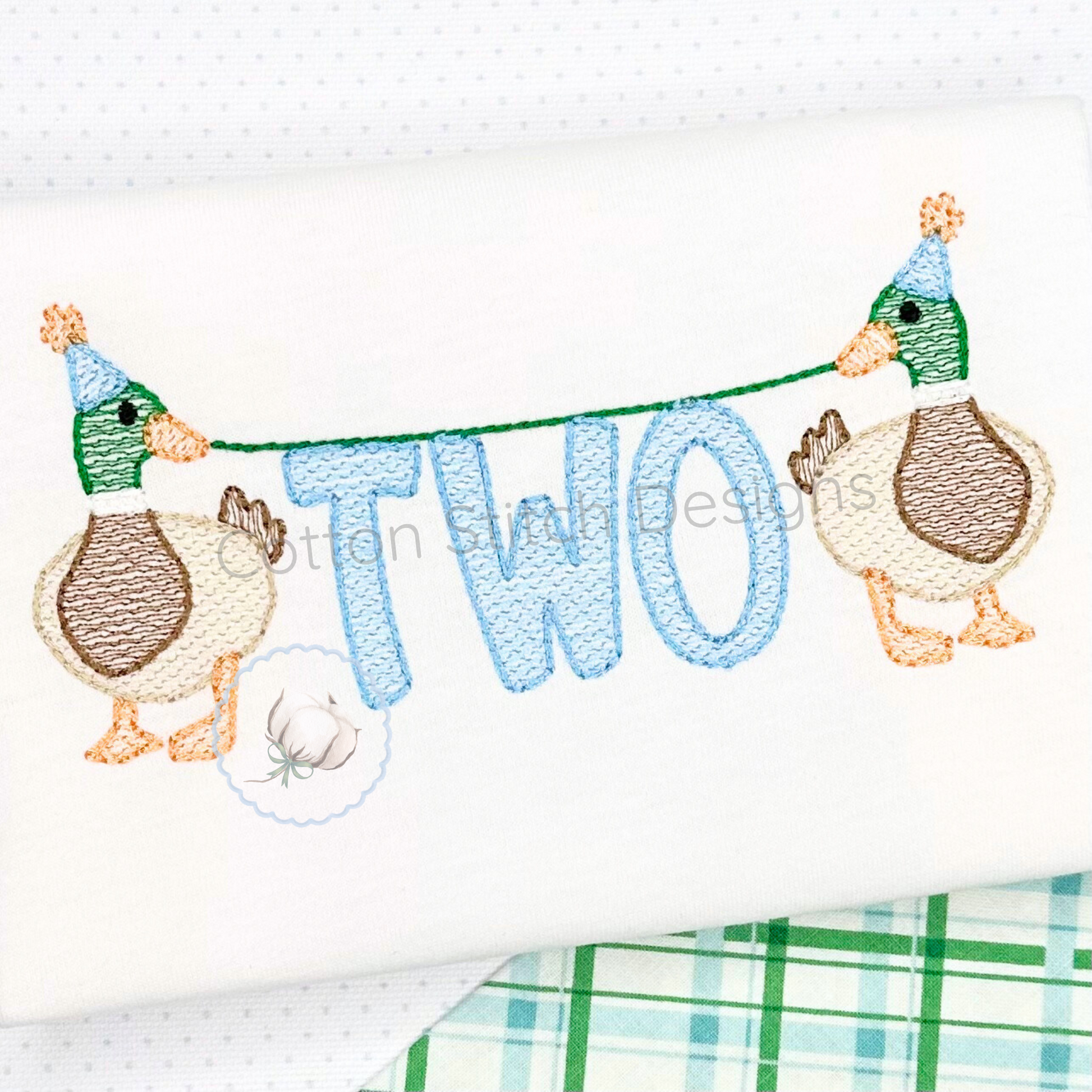 Machine Embroidery design Cotton Stitch Designs Embroidered design with two ducks holding a banner saying 'TWO' on a white background.