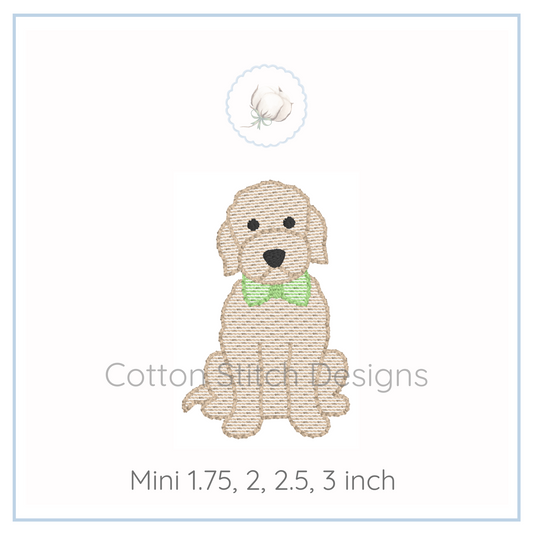 Machine Embroidery design Cotton Stitch Designs Embroidered dog design with a green bow tie on a white background, branded 'Cotton Stitch Designs'.