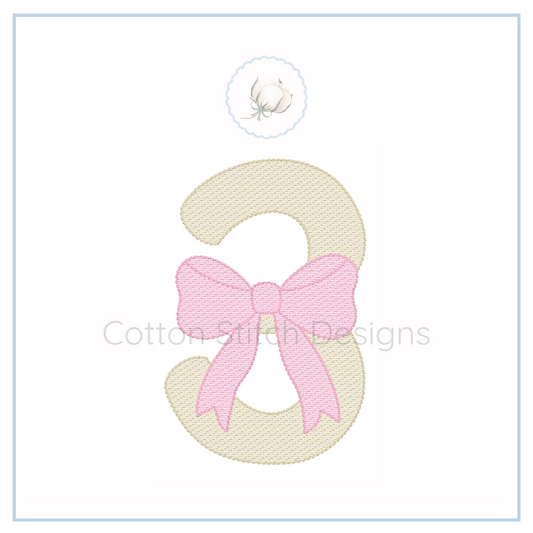 Machine Embroidery design Cotton Stitch Designs Embroidered number '3' with a pink bow on a white background, featuring the brand 'Cotton Stitch Designs'.