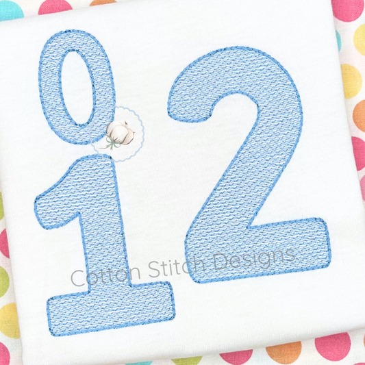 Machine Embroidery design Cotton Stitch Designs Embroidered number '12' on a colorful polka dot background with 'Cotton Stitch Designs' branding.