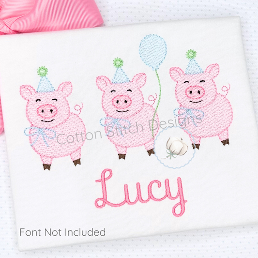 Machine Embroidery design Cotton Stitch Designs Embroidered design of three pink pigs with party hats and balloons on a white pillow, featuring the name 'Lucy'.
