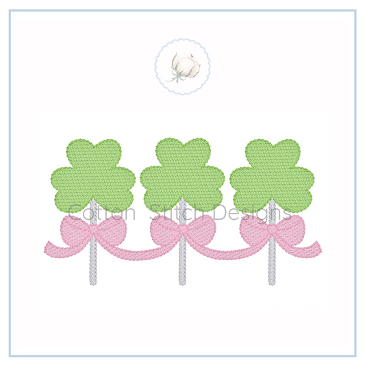 Machine Embroidery design Cotton Stitch Designs Three green four-leaf clover designs with pink bows on a white background