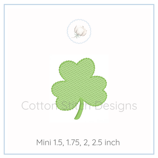 Machine Embroidery design Cotton Stitch Designs Green four-leaf clover patch on a white background with 'Cotton & Cream Designs' branding.