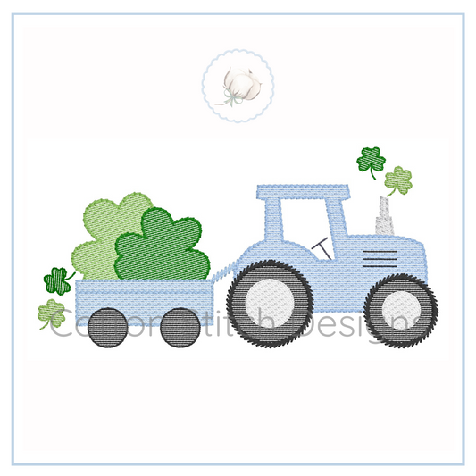 Machine Embroidery design Cotton Stitch Designs Embroidery design of a blue tractor with green clover leaves on a white background