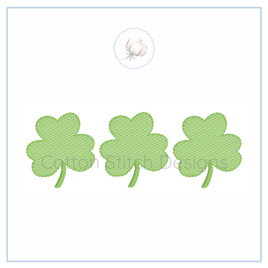 Machine Embroidery design Cotton Stitch Designs Three green four-leaf clover patches on a white background with a brand logo.