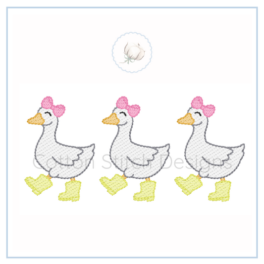 Machine Embroidery design Cotton Stitch Designs Embroidered design of three ducks with bows and boots on a white background