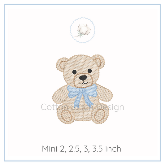 Machine Embroidery design Cotton Stitch Designs Embroidered teddy bear design with a blue bow on a white background.