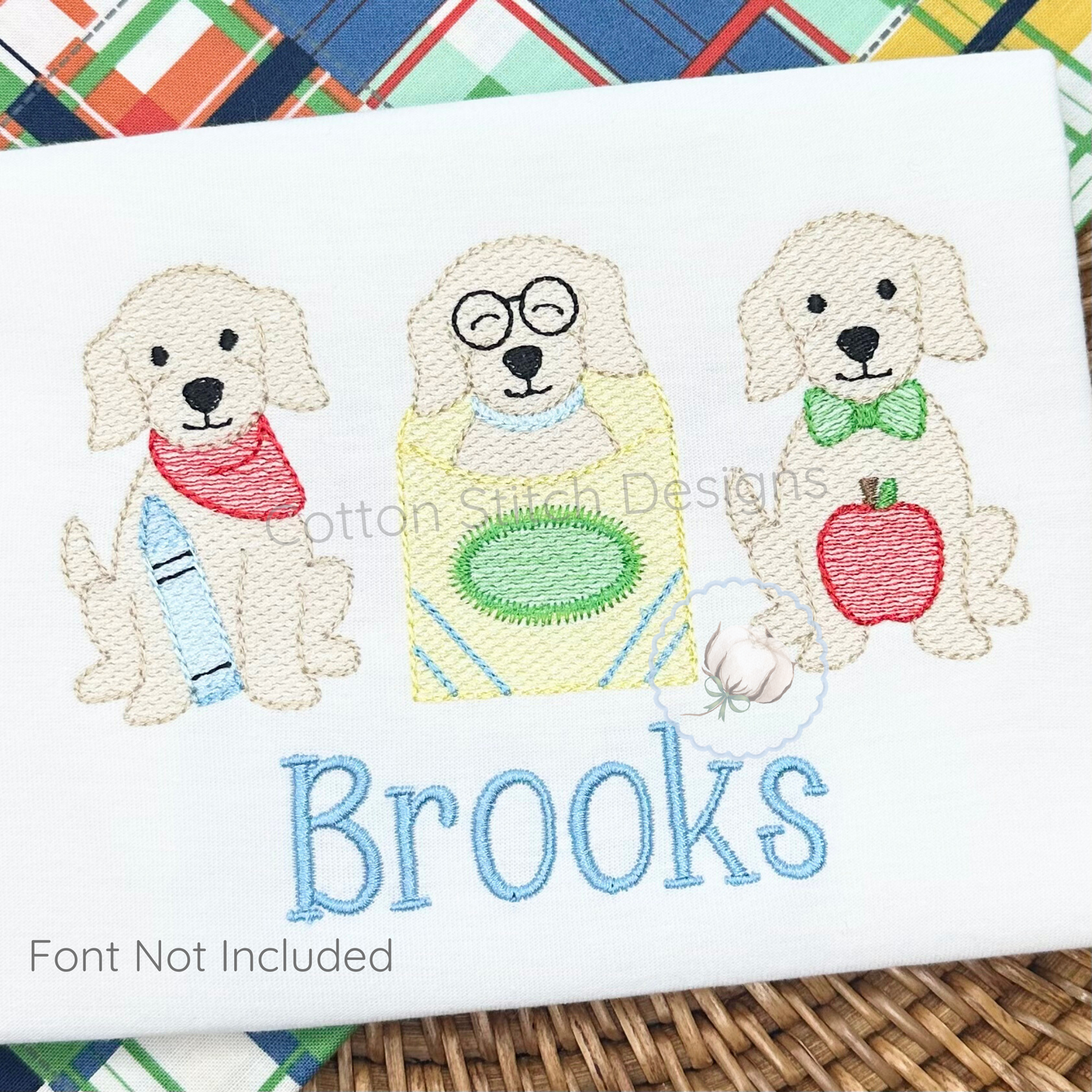 Machine Embroidery design Cotton Stitch Designs Embroidered design of three dogs with accessories and the name 'Brooks' on a white background.