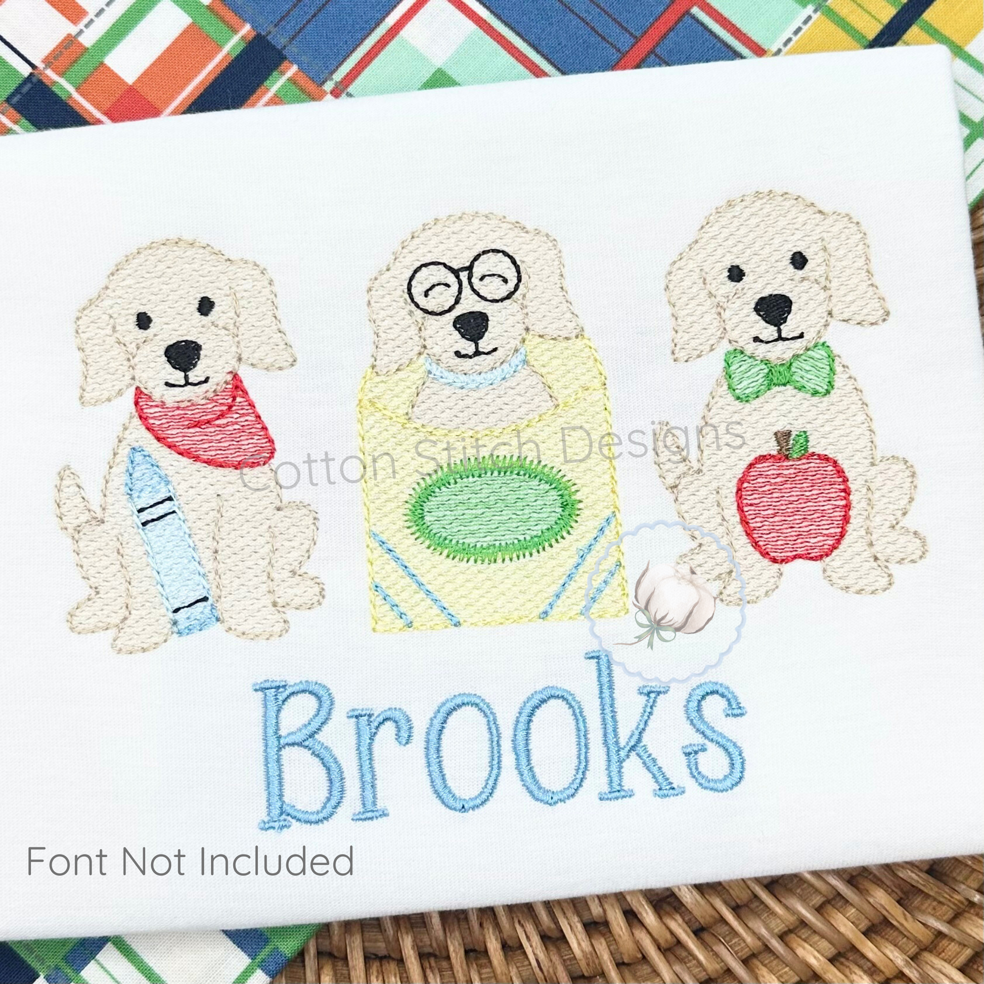 Machine Embroidery design Cotton Stitch Designs Embroidered design of three dogs with accessories and the name 'Brooks' on a white background.