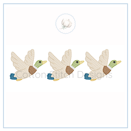 Machine Embroidery design Cotton Stitch Designs Three embroidered ducks on a card with 'Cotton Stitch Designs' branding.